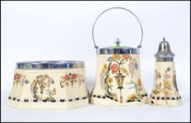 A Parrott and Company Coronet Ware biscuit barrel along with a matching dish,