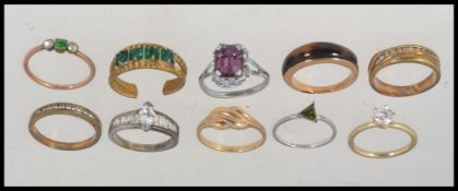 A collection of yellow and white metal vintage 20th century dress rings to include stone set,