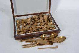 A fabulous 20th century bronze canteen of cutlery complete in the wooden presentation case imported