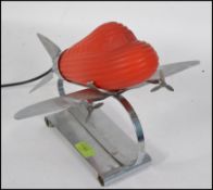 A stunning 1930's Sarsaparilla style Art Deco chrome and glass aeroplane lamp.