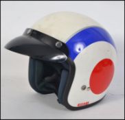 A motorcycle helmet in MOD colours.