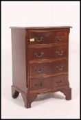 A regency style small bedroom mahogany bow front Chest of Drawers being raised on bracket legs.