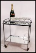 A 1930's Art Deco chrome and glass drinks trolley in the manner of Eileen Grey.