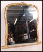 A 19th century large gilt plaster wood overmantel mirror having faux wood gilded finish with