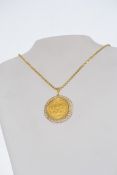 A 14ct gold chain with 18ct gold Olympic Munchen summer games 1972 ( munich) coin medal pendant.