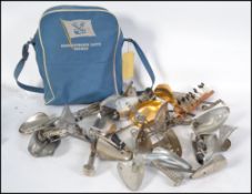 A collection of vintage and retro aluminum cobblers / shop shoe stretchers together with a 1970's