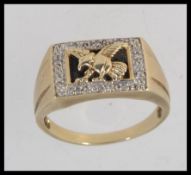 An 9ct gold and diamond gentlemans eagle signet ring. Hallmarked for Sheffield. Weight 6.