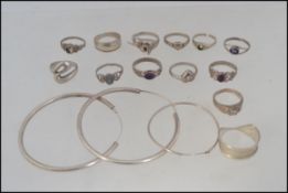 A collection of silver rings to include stone set, ying and yang, fret pierced, band ring,