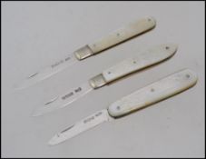 A collection of 3 silver mother of pearl hallmarked fruit knives - pen knives to include examples