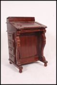 A Victorian style mahogany davenport writing desk.