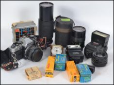 CAMERAS: A collection of cameras and lenses to include Super Albinar 846067 lens,