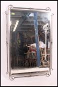 A large contemporary Wrought Iron scroll work mirror,
