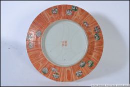 A Chinese charger / plate with central green 5 claw dragon,