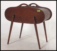 A good mid century teak tambour / roll top sewing box having shaped lozenge cabinet raised on