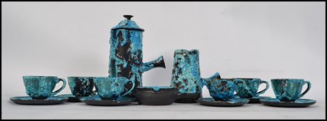A fantastic retro studio pottery fat lava style coffee set having a lidded coffee pot, creamer,