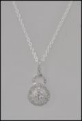 A ladies silver cz baguette channel set pendant on silver link chain.