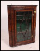 A 19th century Georgian mahogany hanging cabinet.