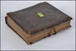 A 19th century / early 20th century leather photograph album containing many photographs - portrait
