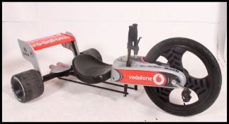 A McLaren three wheeled tricycle go-kart,