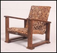 A vintage 1930's Art Deco childs chair with angular show wood frame by Atcraft being upholstered in