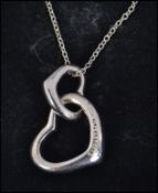 A silver ladies contemporary 925 interlocked heart pendant and necklace chain complete in the box.