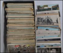 A shoebox containing approximately 600 postcards dating to the early & mid 20th century