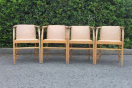A set of 4 bentwood art deco dining chairs having faux cream leather upholstered seats and back