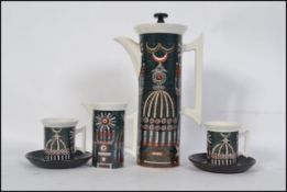 A vintage mid century Portmeirion coffee service in the ' Magic City ' pattern comprising of coffee
