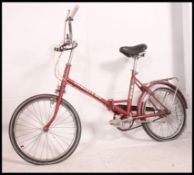 A vintage 1970's ladies Consort 20 bicycle in metallic paint with original decals H42cm