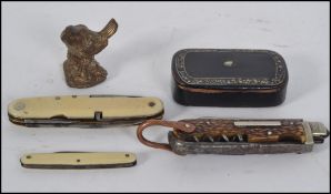A 19th century papier mache snuff box of rectangular form together with a collection of penknives