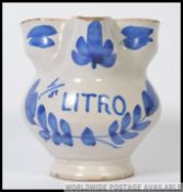 A small blue and white Delft / Faience apothecary jug,
