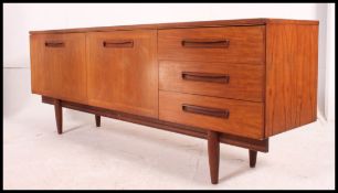 A large vintage mid century G-Plan style teak sideboard having 3 drawers to the right with double