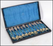 A continental silver cased set of 12 filigree worked teaspoons complete in the original case.