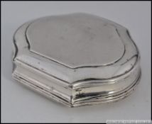 An unmarked Georgian silver snuff box of scalloped form with later 19th century engravings.