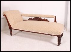 A very good recently re upholstered Victorian Chaise Longue having padded back on carved support,