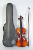 A cased 3/4 violin with paper lable to inside marked copy from Antonius stradivarious,
