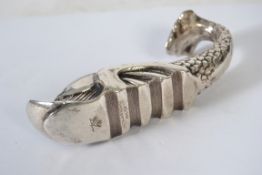 A vintage white metal / plated Maltese dolphin sea serpent paper weight.