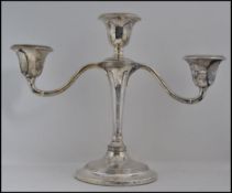 A silver hallmarked 3 sconce candelabra bearing hallmarks for Birmingham 1909 makers illegible,