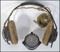 An Air Ministry cockpit clock with Air Ministry symbol to rear, marked to dial MKII S.