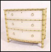 A 19th century painted mahogany bow front scottish chest of drawers raised on bamboo effect legs