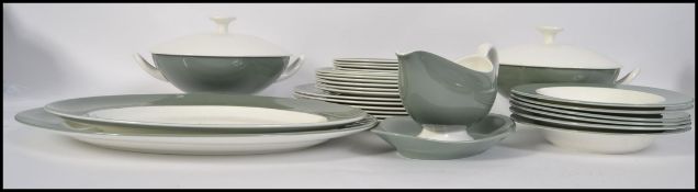 A large 20th century Wedgwood part dinner service to include dinner plates, serving dishes,