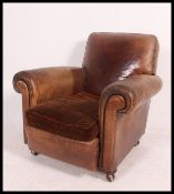A 1930's Art Deco French leather Club armchair having barrel arms complete with the original