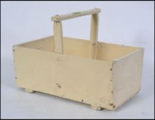 A vintage original mid century painted wooden gardeners vegetable trug having central handle with