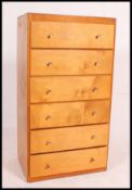 A retro mid century pedestal panel wood chest of drawers.