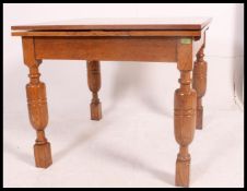 A 1930's Art Deco oak draw leaf refectory dining table.