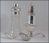 A silver hallmarked sugar caster bearing assay marks for Sheffield 1951 by Walker and Hall .