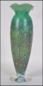 A contemporary Okra Iridescent glass vase of baluster form decorated with stylised flowers over a