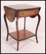 An Edwardian rosewood and marquetry inlaid drop leaf side / lamp table in the manner of Edwards &