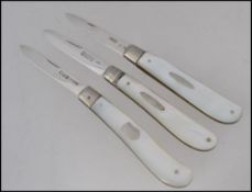 A collection of 3 silver mother of pearl hallmarked fruit knives - pen knives each with plain