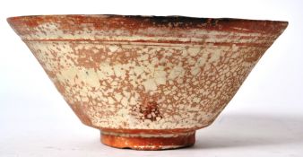 A believed Samanid slip painted pottery bowl from Eastern Persia, circa 10th century.